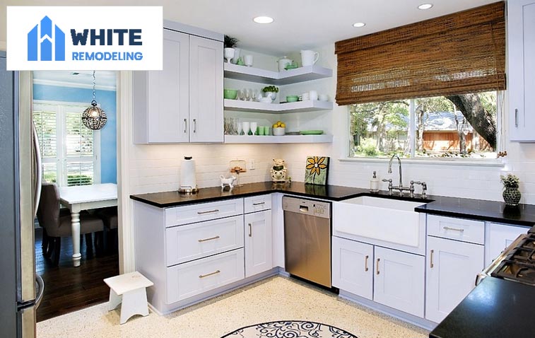 Modern kitchen showcasing open shelving and under countertop storage.